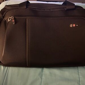 Tumi Black Travel Bag. Medium size.  Two side pockets and front pocket